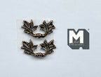 1:12 scale miniature leaf end drawer pulls in antique brass, set of 2, ornate curved handles on a white surface