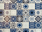 Miniature blue embossed Mediterranean tile sheet, navy, blue and white patterned tiles in close view