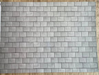Miniature pale gray embossed roof slate sheet, rectangular slate tiles in staggered rows, full sheet shown flat