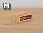 1:12 scale miniature wood fruit crate with a printed fruit label, open top, shown on a wood surface
