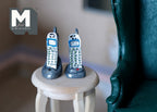 1:12 scale miniature cordless phones in silver with blue keypads, set of 2, shown standing on a round side table