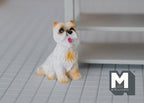 1:12 scale miniature sitting terrier dog in white and tan cast resin with tongue out, shown on a tiled floor