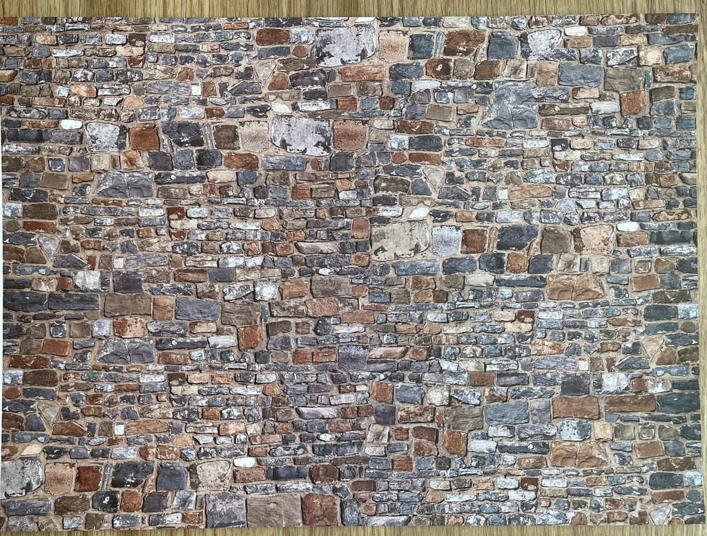 Miniature multicolor embossed stone wall sheet, irregular brown, gray and tan stones in a rustic wall pattern