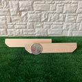 1:12 scale miniature unpainted wood wall shelf with stepped brackets, set of 2, shown on grass beside a coin