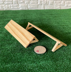 1:12 scale miniature stained wood wall shelves with angled brackets, set of 2, shown on green turf beside a coin