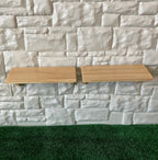 1:12 scale miniature stained wood wall shelves, set of 2, light wood planks shown mounted on a white stone wall