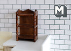1:12 scale miniature wood kitchen spice shelf with 3 tiers in walnut, turned posts, shown on a counter by white tile