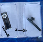 1:12 scale miniature clear faceted door knobs with gunmetal backplates and keys, set of 2, shown in a clear case