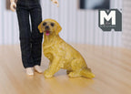 1:12 scale miniature sitting golden retriever dog with open mouth, shown on a wood floor beside a doll