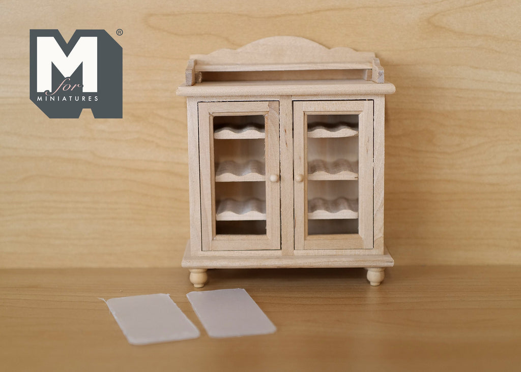 1:12 scale miniature unpainted wood wine cabinet with 2 glazed doors and scalloped top, clear door panels shown in front