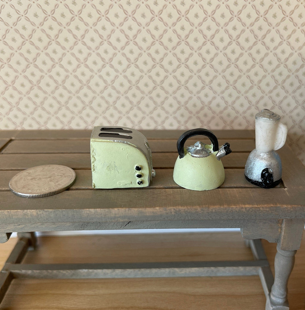 1:12 scale miniature toaster, kettle and blender in mint green resin, set of 3, shown on a wood table with a coin