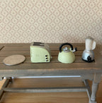 1:12 scale miniature toaster, kettle and blender in mint green resin, set of 3, shown on a wood table with a coin