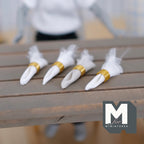 1:12 scale miniature napkins with napkin rings, set of 4, white napkins in gold rings on a wood plank table
