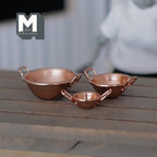 1:12 scale miniature metal mixing bowls with handles in copper, set of 3 nesting sizes, shown on a wood table