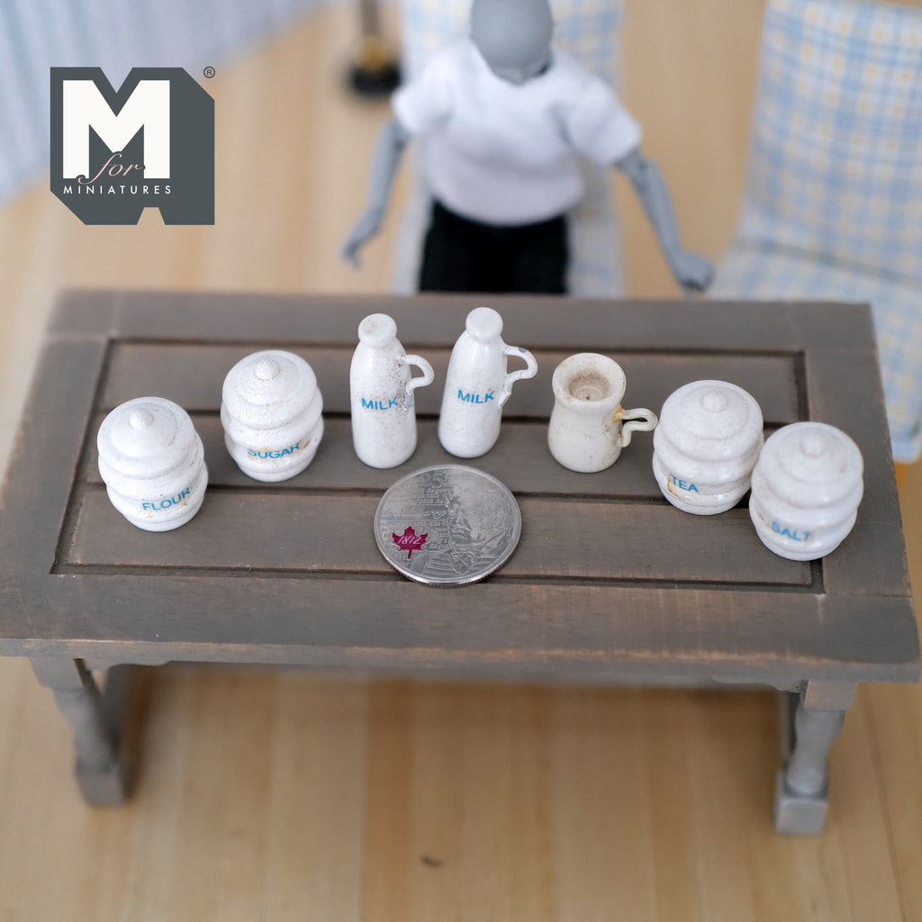 1:12 scale miniature wood vintage kitchen canisters, milk jugs and cream jar in white, set of 7, beside a coin