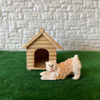 1:12 scale miniature wood log cabin dog house with a peaked roof, shown on green grass with a dog figure