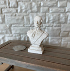1:12 scale miniature cast resin bust sculpture of a man in a suit, white, shown on a wood table beside a coin