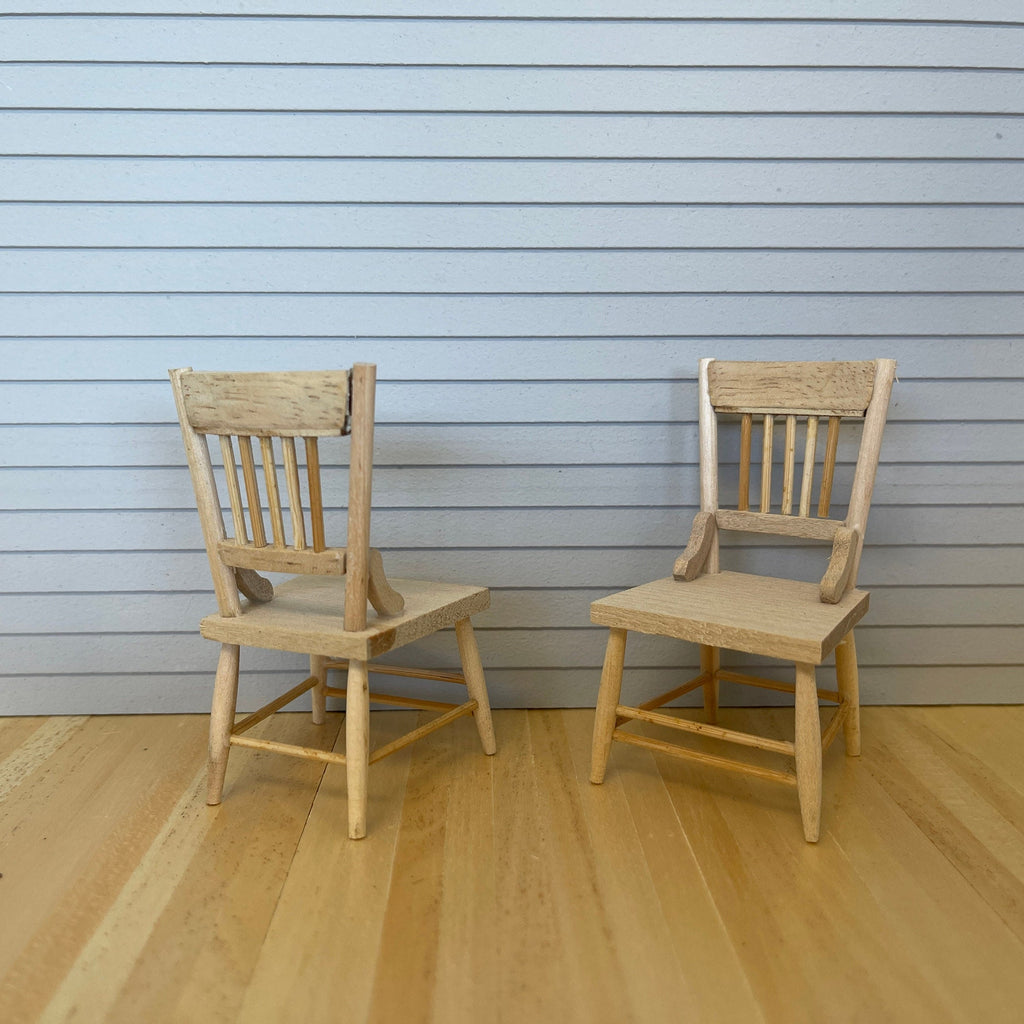 1:12 scale miniature unpainted wood kitchen chairs with spindle backs, set of 2, shown on a wood floor