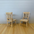 1:12 scale miniature unpainted wood kitchen chairs with spindle backs, set of 2, shown on a wood floor