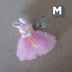 1:12 scale miniature ballet tutu dress in pink with roses and lace, tulle skirt, laid flat beside a coin for scale