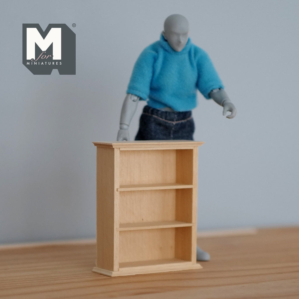 1:12 scale miniature unpainted wood kitchen shelf unit with 3 shelves, shown beside an artist figure