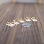 1:12 scale miniature wood mouse traps with cheese bait, set of 5, shown on a wood floor beside a coin for scale
