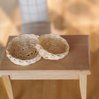 1:12 scale miniature woven round trays made from rope, set of 2, large and small, natural color on a wood table