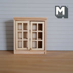 1:12 scale miniature unpainted wood kitchen wall cabinet with 2 lattice doors, shown on a wood surface