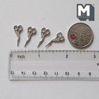 1:12 scale miniature metal stork embroidery scissors, set of 4, silver tone, shown with a coin and a ruler for scale