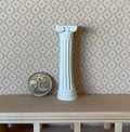 1:12 scale miniature Ionic column in white cast resin with fluted shaft and scroll capital, shown beside a coin