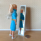1:12 scale miniature full length floor mirror on stand in white, shown with a figure in a blue dress and a coin
