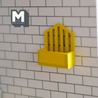 1:12 scale miniature wood wall mail holder in yellow with slatted back, mounted on a white brick wall