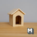 1:12 scale miniature wood dog house kennel in bare wood with a peaked roof and arched opening, shown on a wood table