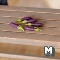 1:12 scale miniature eggplants in dark purple with green stems, set of 5, shown on a wood slat table