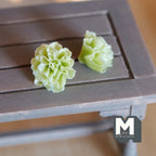 1:12 scale miniature green leaf lettuce heads, set of 2, ruffled leaves, shown on a gray wood table