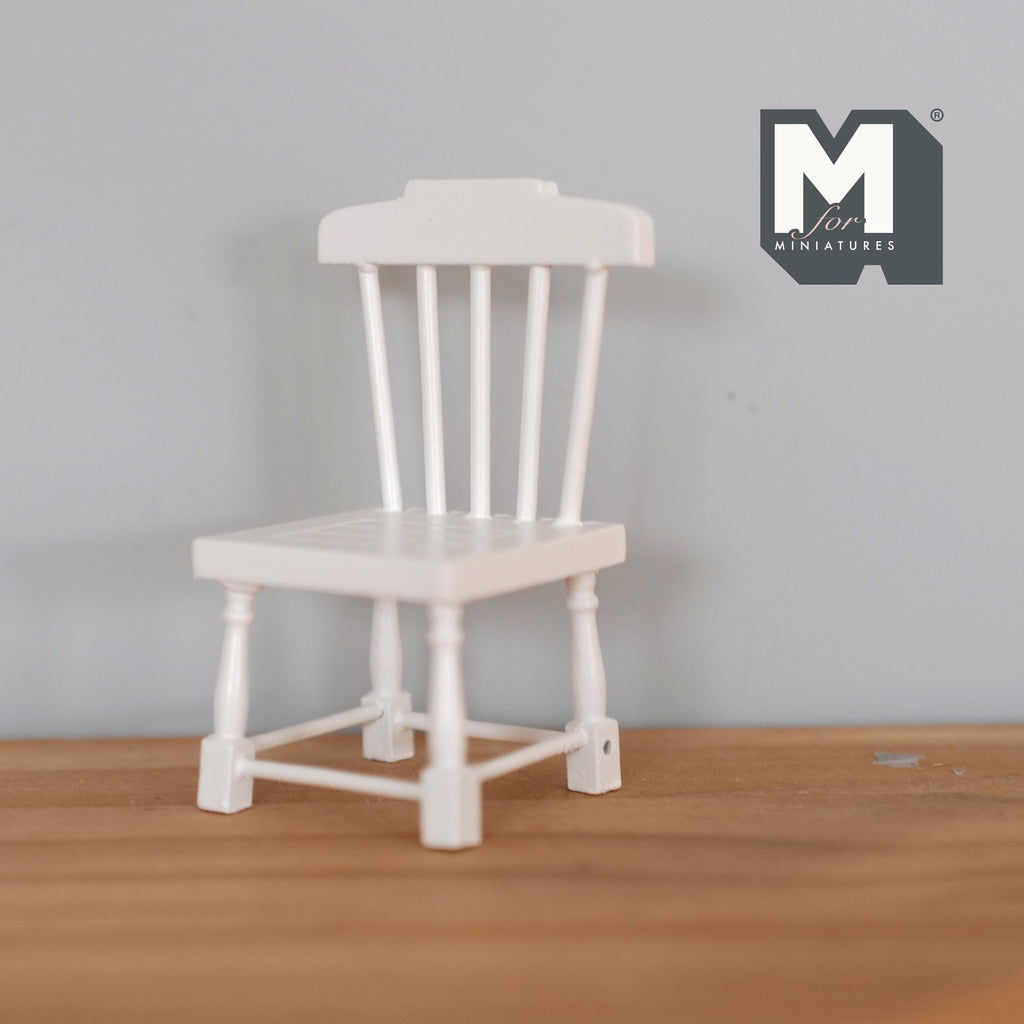 1:12 scale miniature wood slat back dining chair in white with turned legs, shown on a wood floor