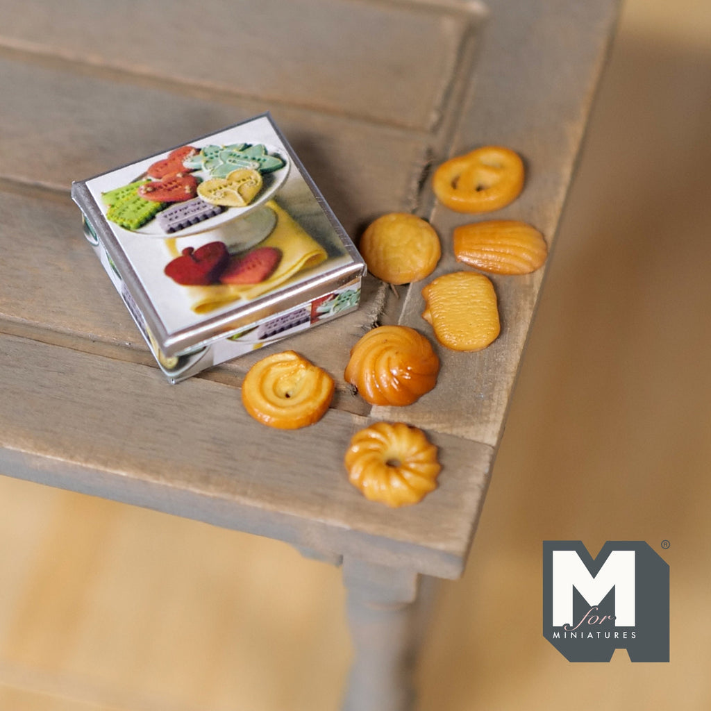 1:12 scale miniature butter cookie tin with 7 loose cookies, printed lid, shown on a rustic wood table