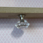1:12 scale miniature faceted crystal look ceiling light in clear with a silver cap, non working, mounted on a ceiling