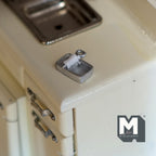 1:12 scale miniature opened tin can with food in silver, rectangular with a rolled back lid, on a cream kitchen counter