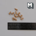 1:12 scale miniature unpainted wood door knobs, set of 12, shown scattered above a ruler for scale
