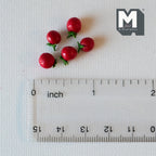 1:12 scale miniature tomatoes in red with green stems, set of 5, shown above a clear ruler for scale