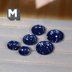 1:12 scale miniature speckled enamelware bowls and plates in navy blue with white specks, set of 6, on a gray wood table