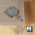 1:12 scale miniature metal barbecue grill grate in silver with wire mesh and long handle, on a wood table