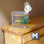 1:12 scale miniature glass fish tank with yellow fish and green seaweed, clear square tank on a wood dresser