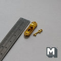 1:12 scale miniature gold door knob plate with key, ornate backplate shown beside a metal ruler on gray fabric