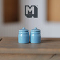 1:12 scale miniature blue ceramic jars with lids, set of 2, glossy canisters shown on a wood surface