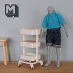 1:12 scale miniature white rolling utility cart with 3 tiers and 2 wood covers, shown beside a figure for scale