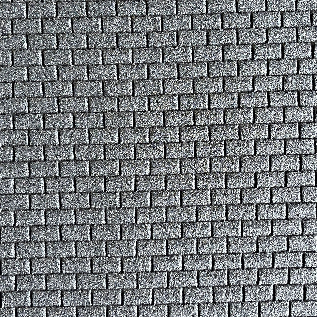 1:12 scale running bond brick wall foam board in gray with a stone like texture, close view of the brick pattern