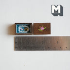 1:12 scale miniature wood jewelry box with necklaces and a painted flower lid, shown open with a ruler for scale