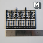 1:12 scale miniature scrollwork railing and garden fence in black with spear finials, shown with a ruler